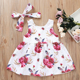Precioso y femenino vestido abotonado y flores fucsias, incluye lazo de igual tela