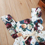 Femenino y precioso enterito floreado con broche inferior