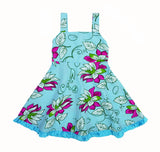 Vestido elegante y precioso, turqueza con flores grandes