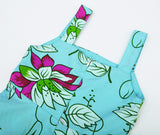 Vestido elegante y precioso, turqueza con flores grandes