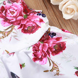 Precioso y femenino vestido abotonado y flores fucsias, incluye lazo de igual tela