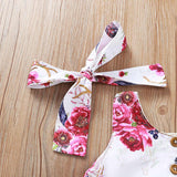 Precioso y femenino vestido abotonado y flores fucsias, incluye lazo de igual tela