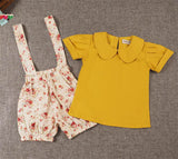 Conjunto de dos piezas, jardinera de tela floreada y blusa color mostaza